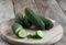 Several cucumbers on a cutting board