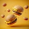 Several Delicious fast food hamburgers flying on a yellow background.