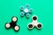 Several different fidget spinners . Isolated on blue background