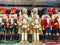 Several different nutcraker soldiers toys displayed in a store, christmas decoration for sale in market Happy New Year
