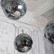 Several disco balls hanging under the ceiling - party decoration
