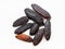 Several dried tonka beans close up on gray