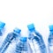 Several drinking water bottles on white background