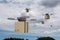 Several drones flying with cardboard boxes. Drone delivery concept. 3d illustration