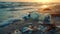 Several empty plastic water bottles discarded on a sandy beach.