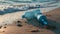 Several empty plastic water bottles discarded on a sandy beach.