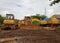 several excavators on display at the roadside of the racing center