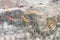 Several excavators work in the excavation of a demolished building, aerial view