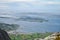 Several ferries crossing Norwegian sea among small islands of Vega archipelago