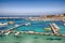 Several fishing boats at the Otranto harbour - coastal town in Puglia with turquoise sea