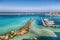 Several fishing boats at the Otranto harbour - coastal town in Puglia with turquoise sea