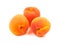 Several five group ripe orange apricots, peaches isolated on whi