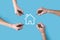 Several, four hands draw a house icon with a marker.Real estate concept.Property insurance and security concept.Innovation