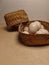 several freshly picked eggs in a bamboo basket on the table