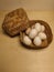 several freshly picked eggs in a bamboo basket on the table