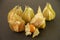 Several fruits of the physalis on a dark background