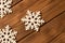 Several funny toy snowflakes on wooden background