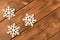 Several funny toy snowflakes on wooden background