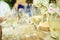 Several glasses with bubbly and fresh champagne served on the table of a banquet