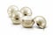 Several golden sphere cosmetic jar on white