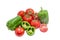 Several green bell peppers and tomatoes on a light background