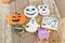 Several Halloween themed buttery cookies on brown paper top view