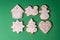 Several handmade cookies in the shape of glaze in the shape of Christmas toys