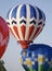 Several Hot Air Balloons Lift-Off