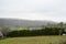 Several houses and green meadows. Countryside in France