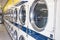 Several laundromat dryers