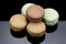Several macaroons on a black background
