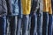 Several mannequins dressed in winter jackets and jeans