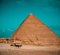 Several men on horses riding around the great pyramids of giza, vibrant orange and teal colors on a nice winter day