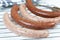 Several merguez and sausage on a white background