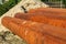 Several metal pipes lying on the street for laying sewage