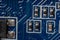 Several microcircuits on a motherboard in a dusty personal computer close-up
