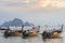 Several moored thai traditional long-tail boat in the sea water near the