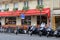 Several motorcycles lined up in front of restaurant,Paris,France,2016