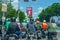 Several online motorcycle taxis stopped at a traffic light crammed into a group of other motorcyclists. SLEMAN, INDONESIA -