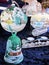 Several painted Christmas decorations, bells, candle holder and