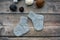 Several pairs of woolen newborns socks, on dark background