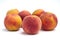 Several peaches isolated on white background