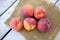 Several peaches on a table