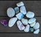 Several pebble stones on wood textured plastic background