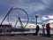 Several people fishing and viewing the landscape from the Pier 54 docks