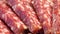 Several pieces of sausage close-up. Salami, full frame. Full hd video, selective focus
