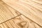 Several planks of beautiful laminate or parquet flooring with wooden texture as background