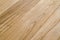 Several planks of beautiful laminate or parquet flooring with wooden texture as background