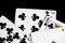 Several playing cards on a dark background c