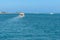 several pleasure boats in the sea near the islands. boats in beautiful turquoise ocean near an island